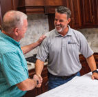 Custom Home builder - men shaking hands and smiling